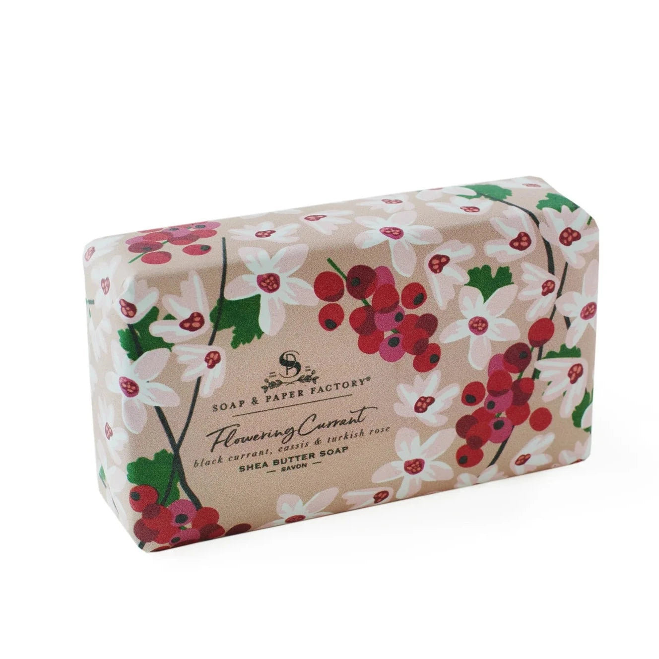 A 'Soap & Paper Factory' shea butter soap bar with a pink and white floral wrapper. The label on the front reads "Flowering Currant" and specifies "black currant, cassis & turkish rose."