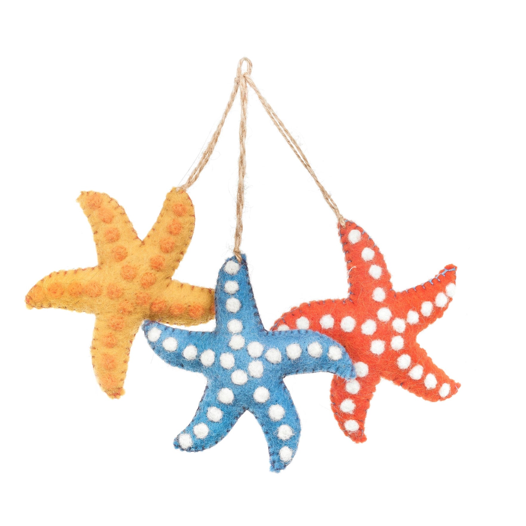 A handmade hanging felt decoration featuring three starfish is shown. The starfish are light orange (with dark orange dots ), blue, red and each has white polka dots.