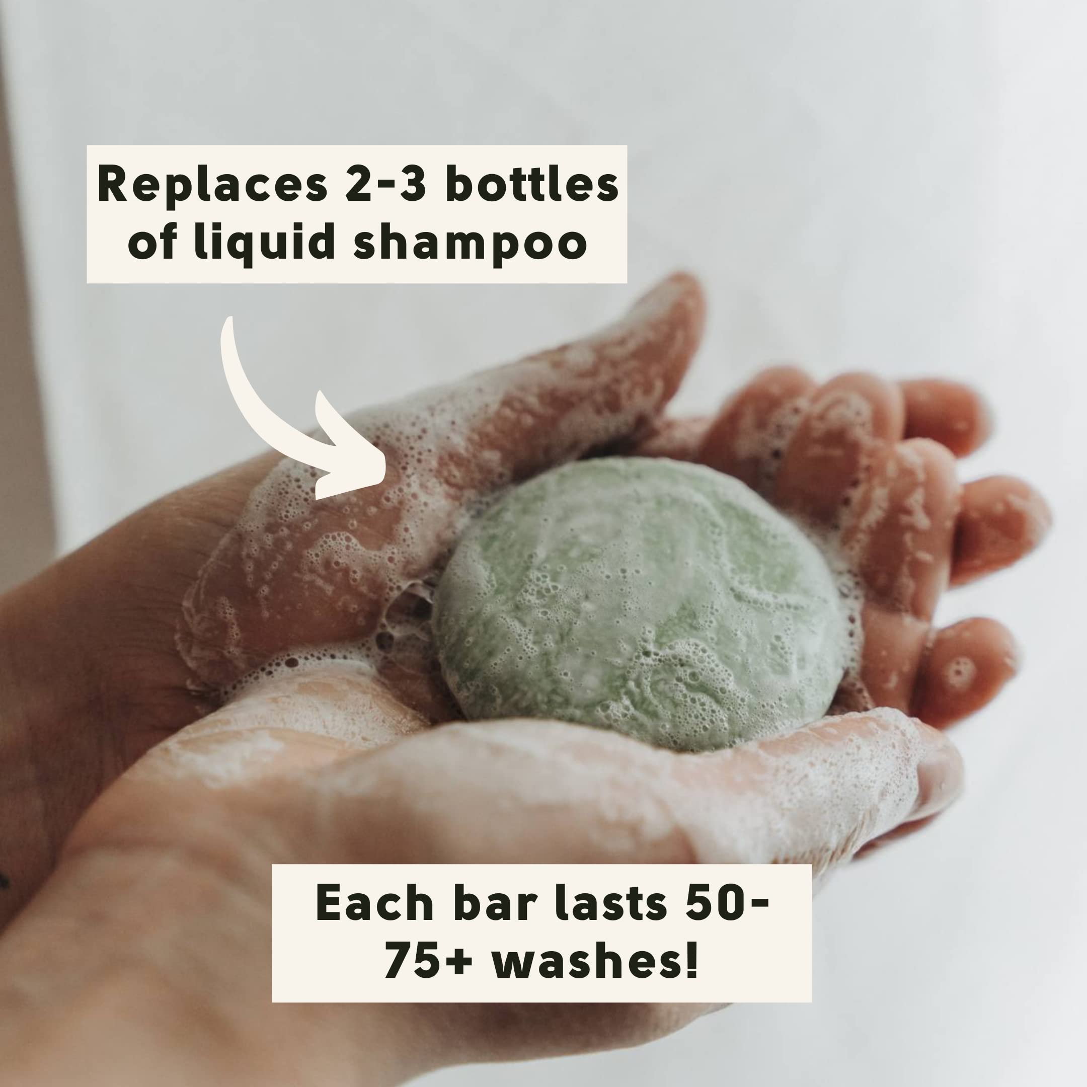 Two hands are cupped together holding a sudsy green shampoo bar. Text notes it replaces 2-3 bottles of liquid shampoo. Some writing on the bar is obscured by the suds and cannot be read.