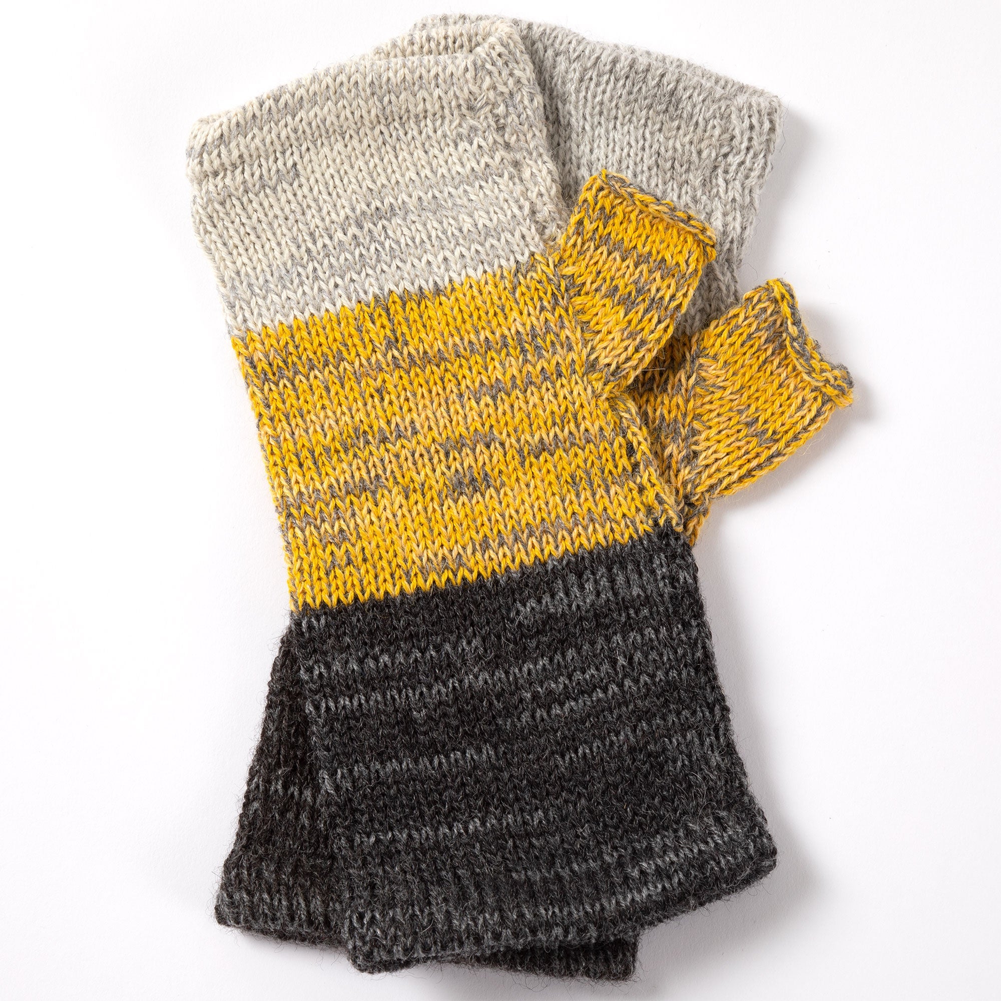 Black, yellow, and light brown alpaca fingerless mittens displayed to highlight the textured pattern and handmade craftsmanship.