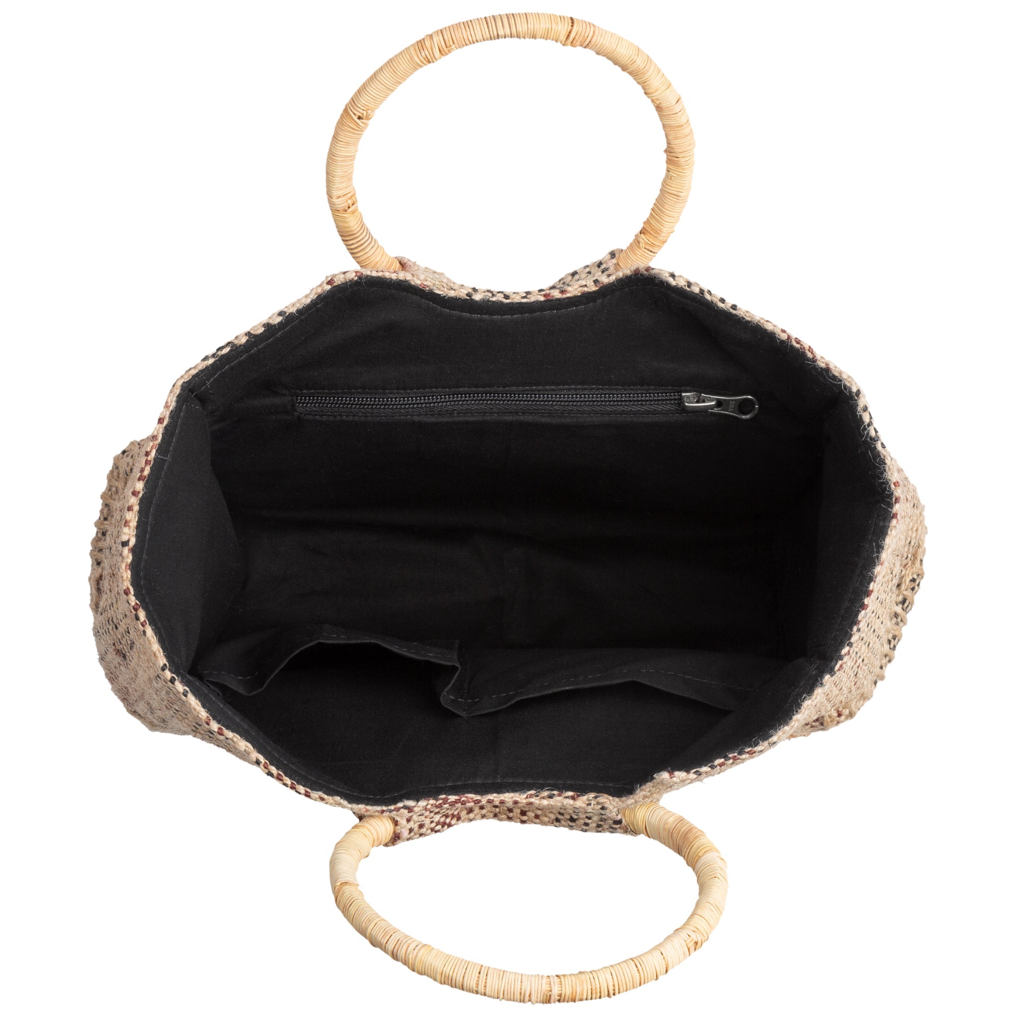 Open view of the bag’s inside, revealing cotton lining and organized compartments. Crafted from sustainable palm fiber with ethical production.