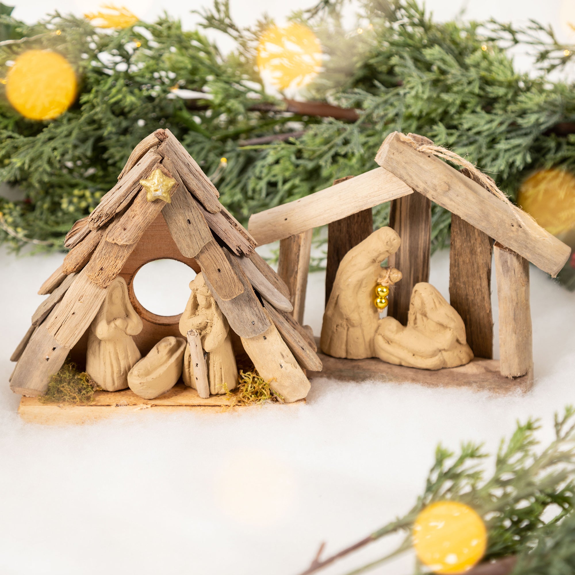 Set of two handmade nativity ornaments made of recycled driftwood and clay, ideal for eco-friendly Christmas.