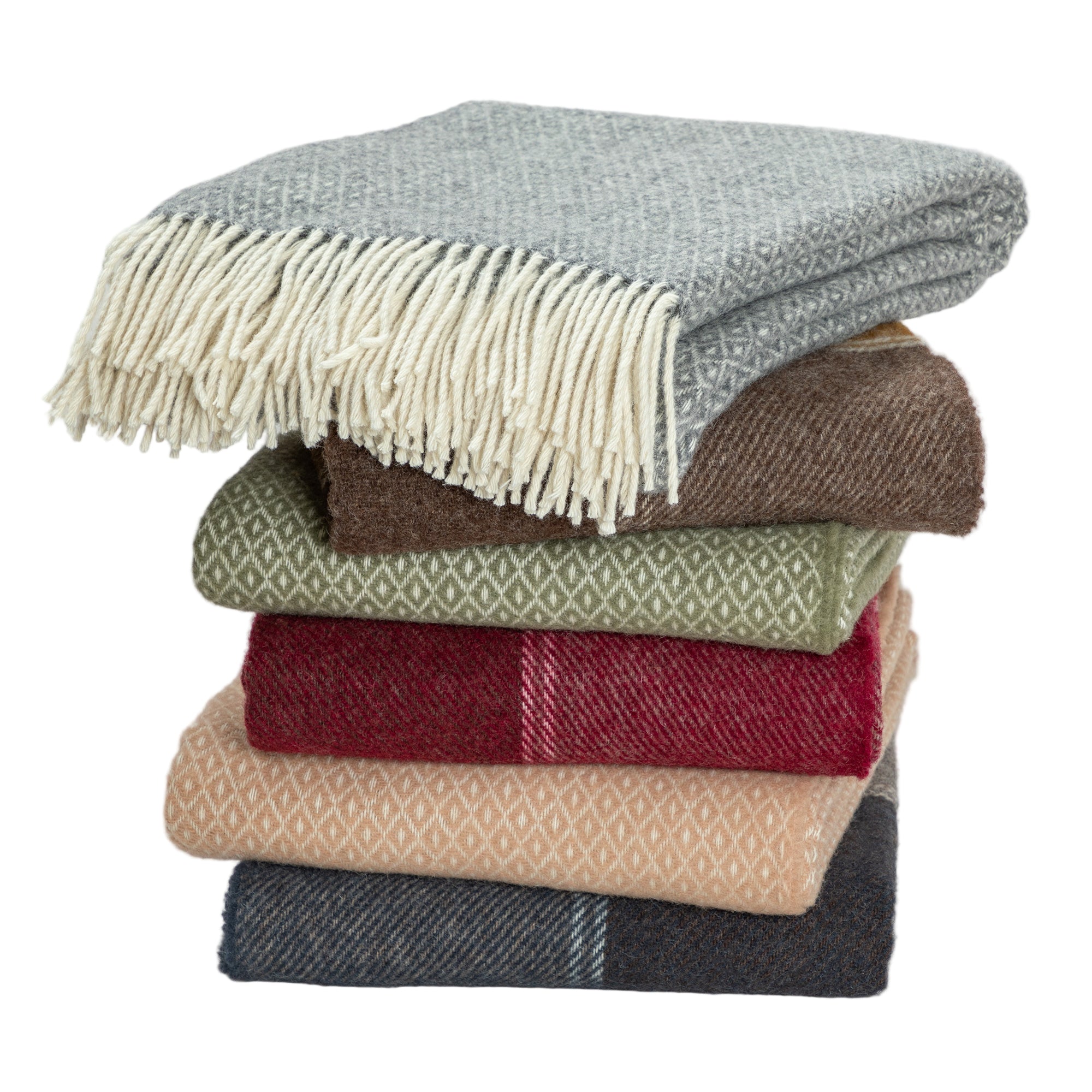 Stack of folded wool blankets in various colors and patterns, including gray, brown, olive green, red, beige, and navy, showcasing fringed edges.