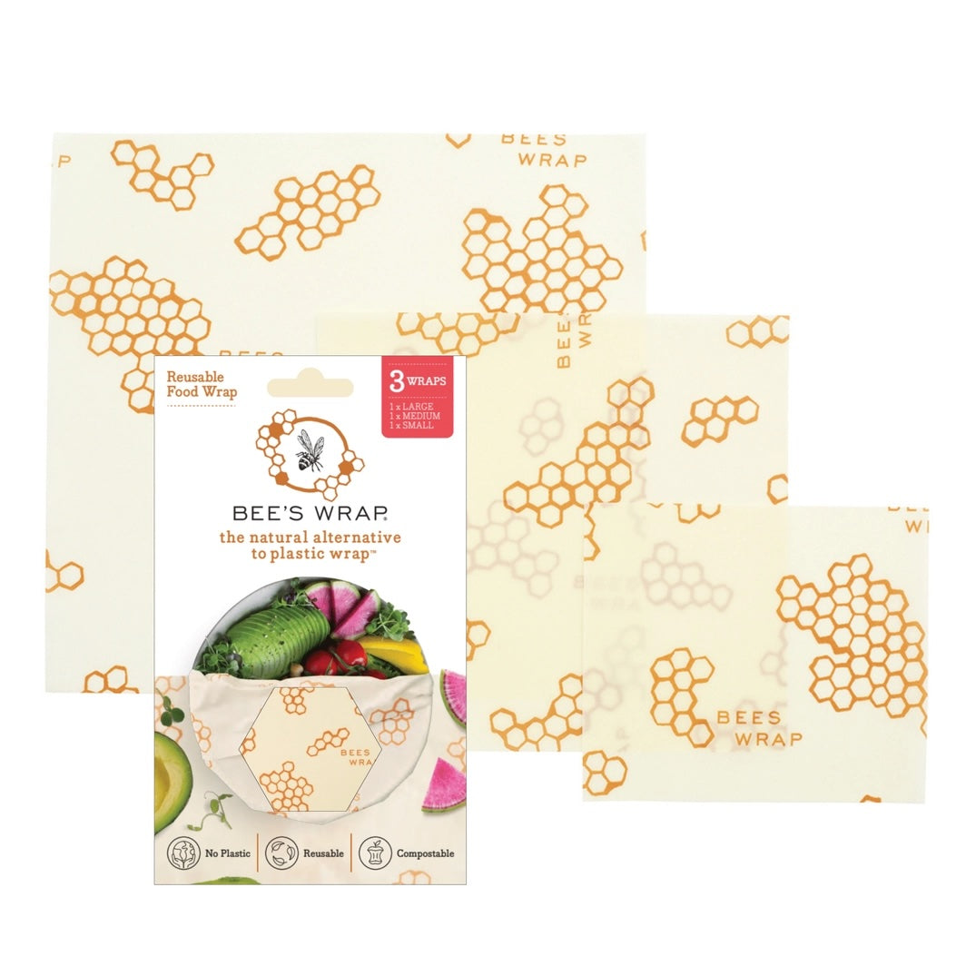 Packaging and three sizes of Bees Wrap with orange honeycomb pattern, a reusable and compostable alternative to plastic wrap.