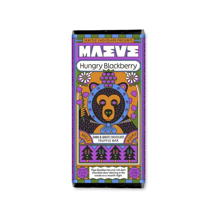 Close-up of the “Blackberry” Maeve chocolate bar showing packaging illustration details in purple, orange and blue.