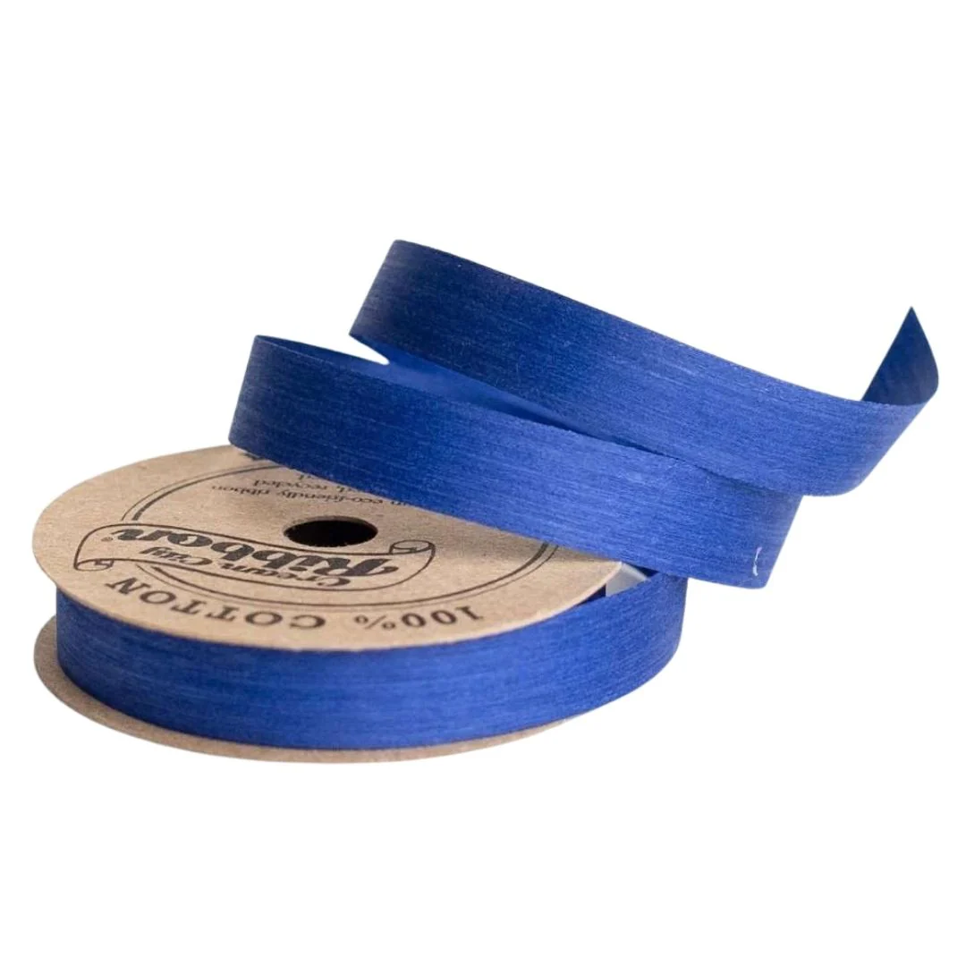 Bright blue natural cotton curling ribbon spool, crafted from 100% cotton yarn with water-based dyes. Sustainable, compostable, and made in the USA.