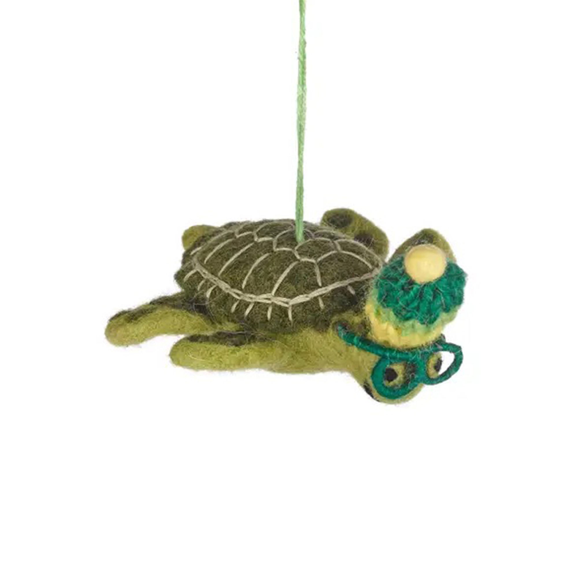 Hanging felt turtle ornament on a white background