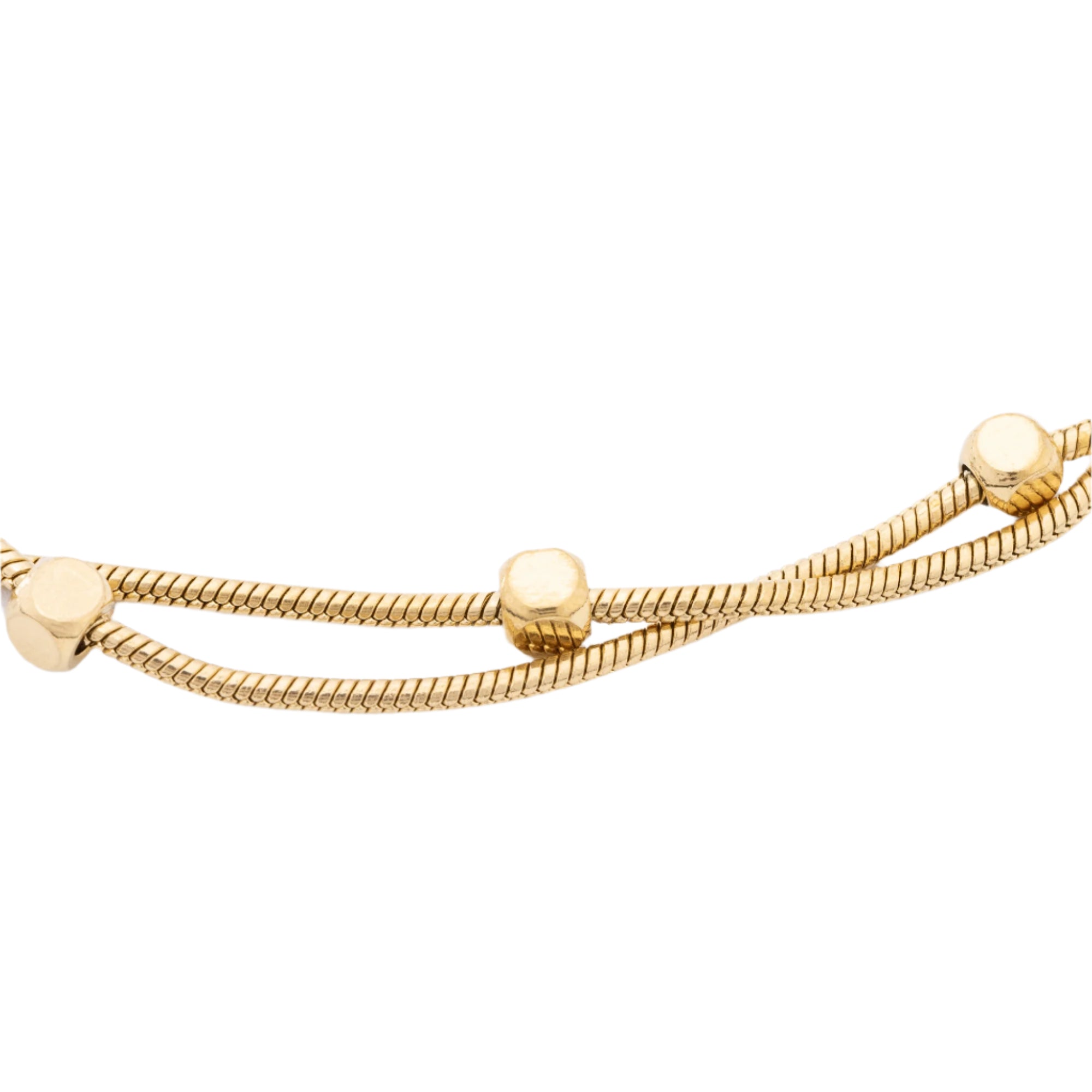 This eco-friendly double strand bracelet showcases subtle gold dots on recycled gold chains, combining modern design with durability for ocean lovers.