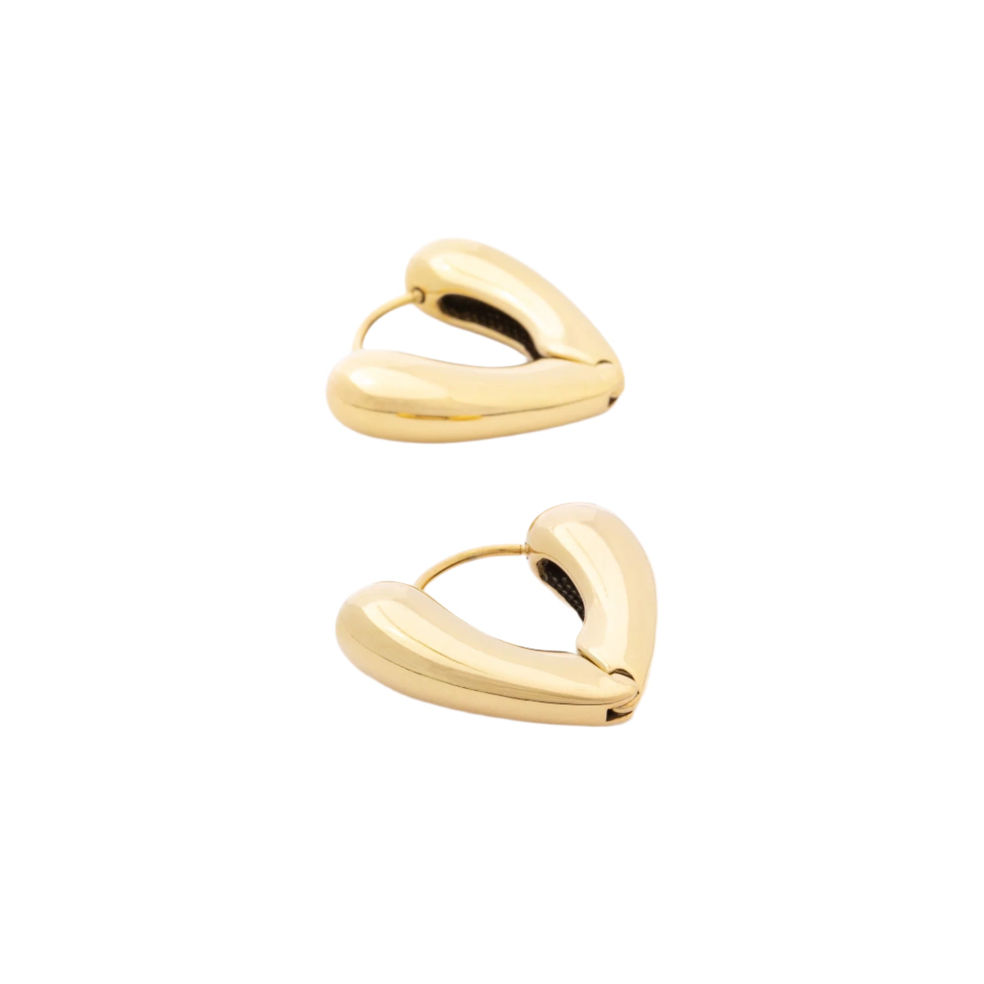 A pair of Huggie Heart earrings in 14K recycled gold, displayed against a soft background. Their classic heart-shaped design offers a romantic yet sustainable statement.