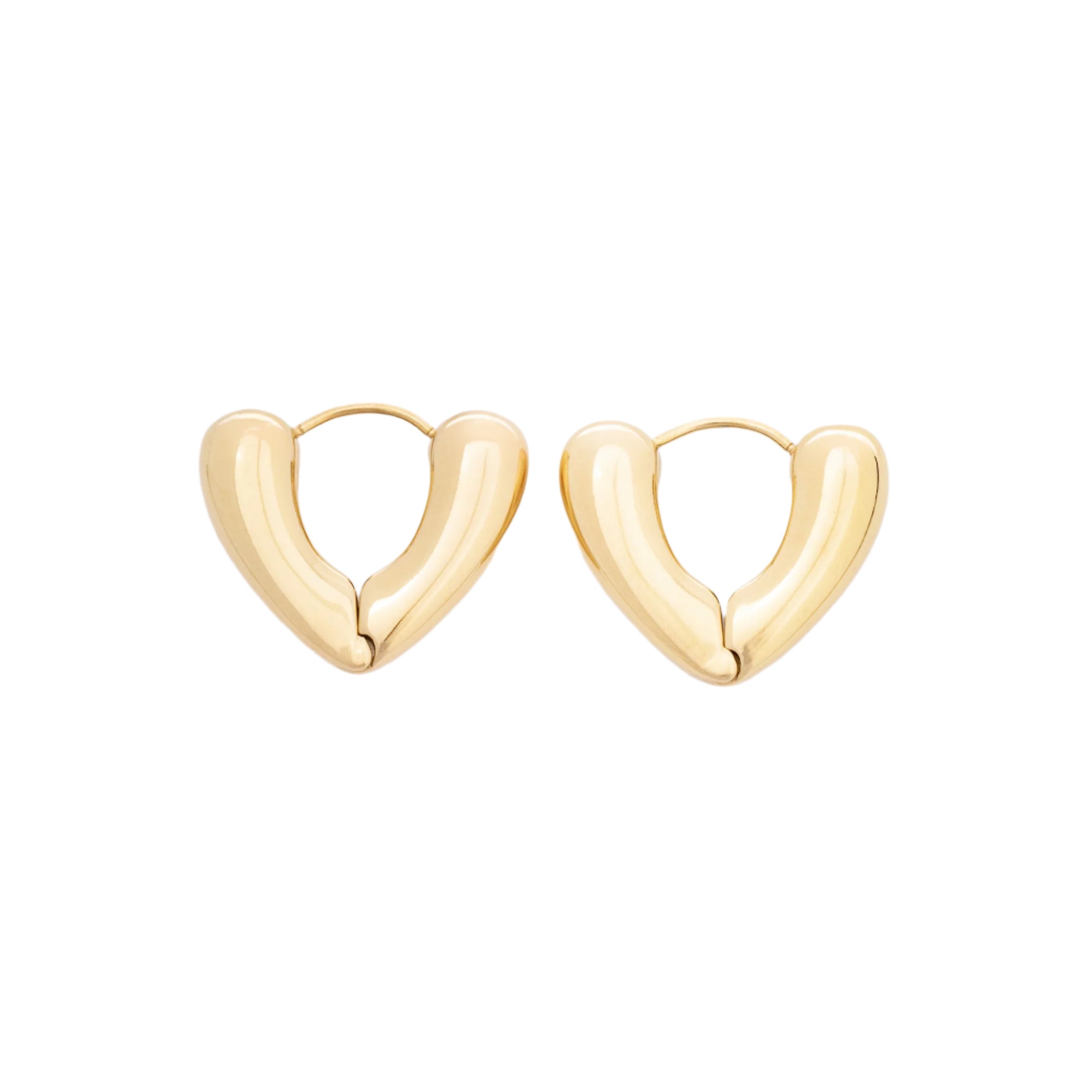 A close-up of recycled 14K gold Huggie Heart earrings, showcasing their smooth, polished surface and delicate heart shape. Crafted sustainably, these earrings combine timeless style with eco-conscious elegance.