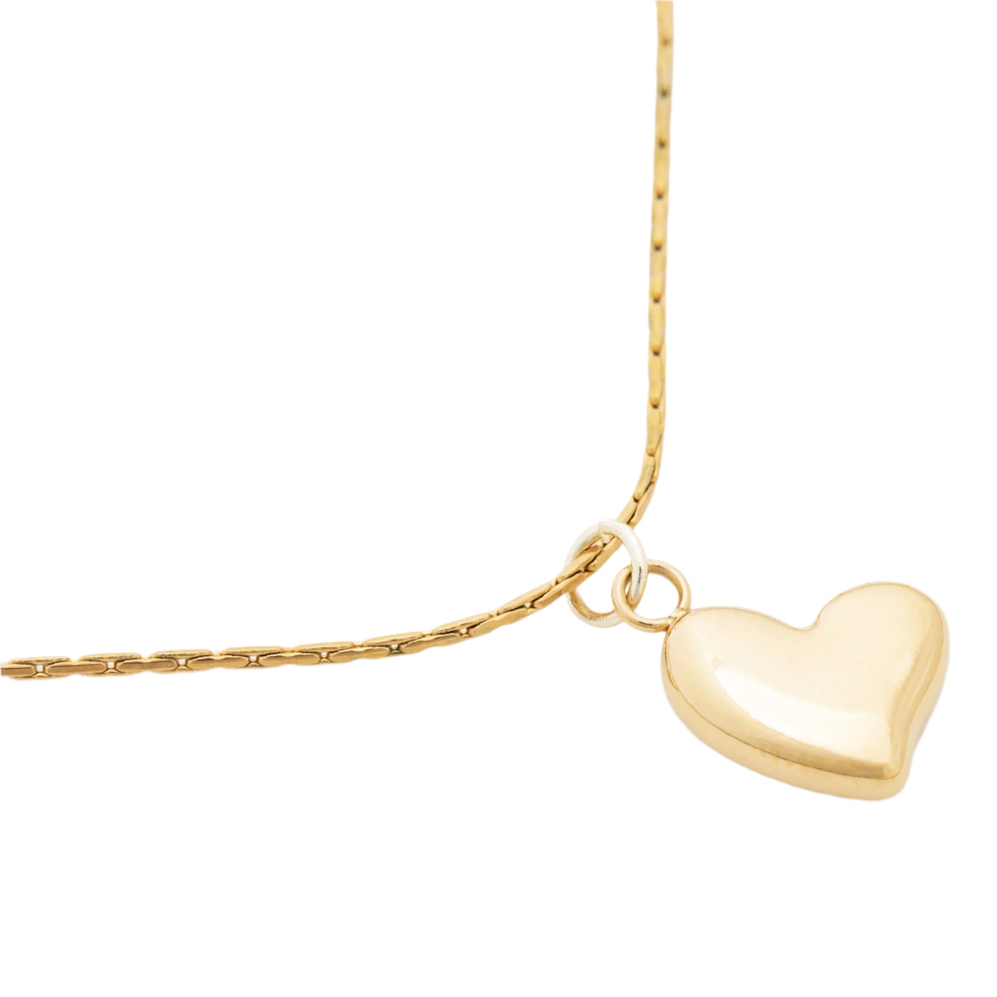 Close-up of the Ocean Love necklace’s heart pendant, reflecting light with a smooth, polished surface and eco-friendly design.