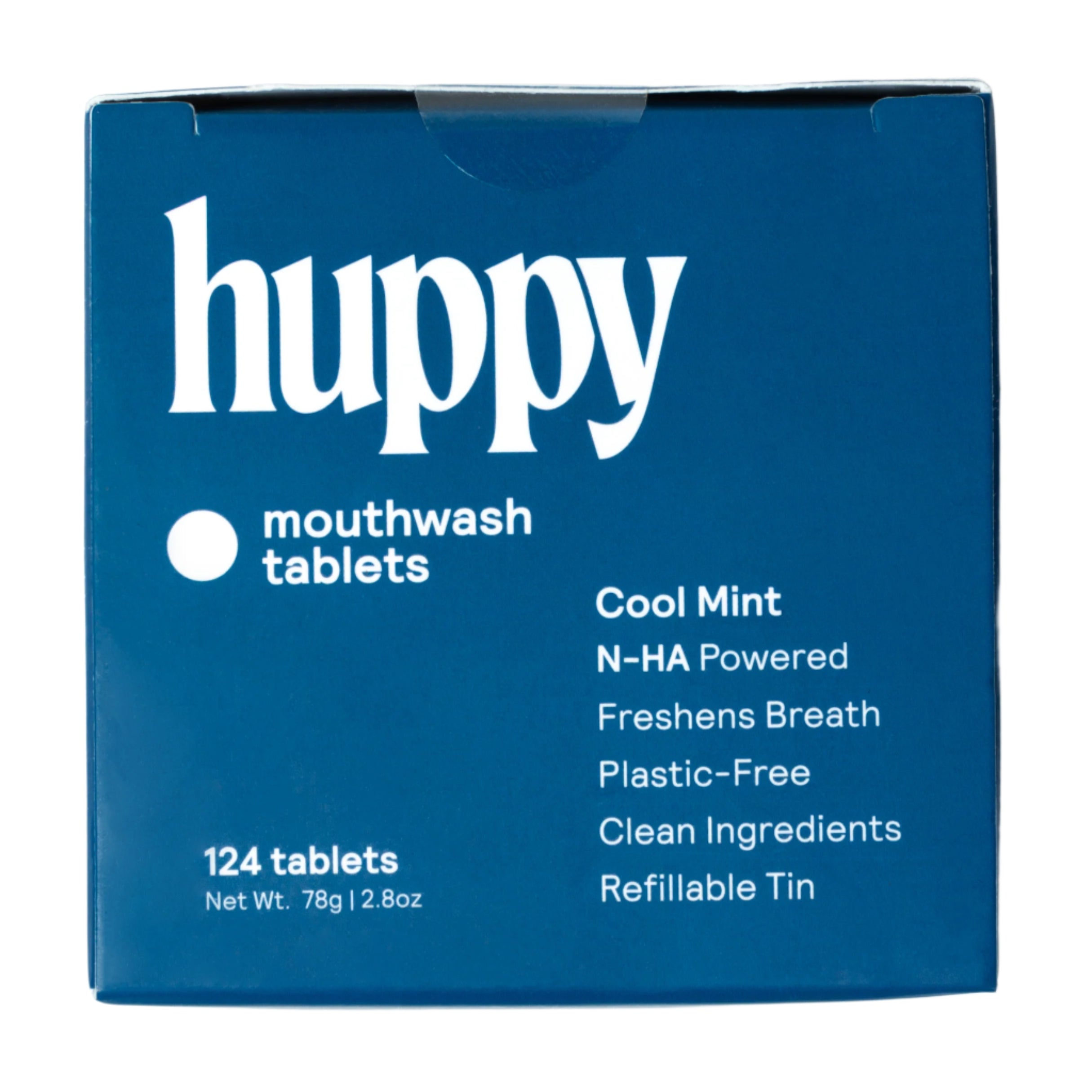 A close-up of a Huppy mouthwash tablets box. The box is blue with a white logo and text that says "124 tablets" "Cool Mint" and lists the product's plastic-free and refillable features.