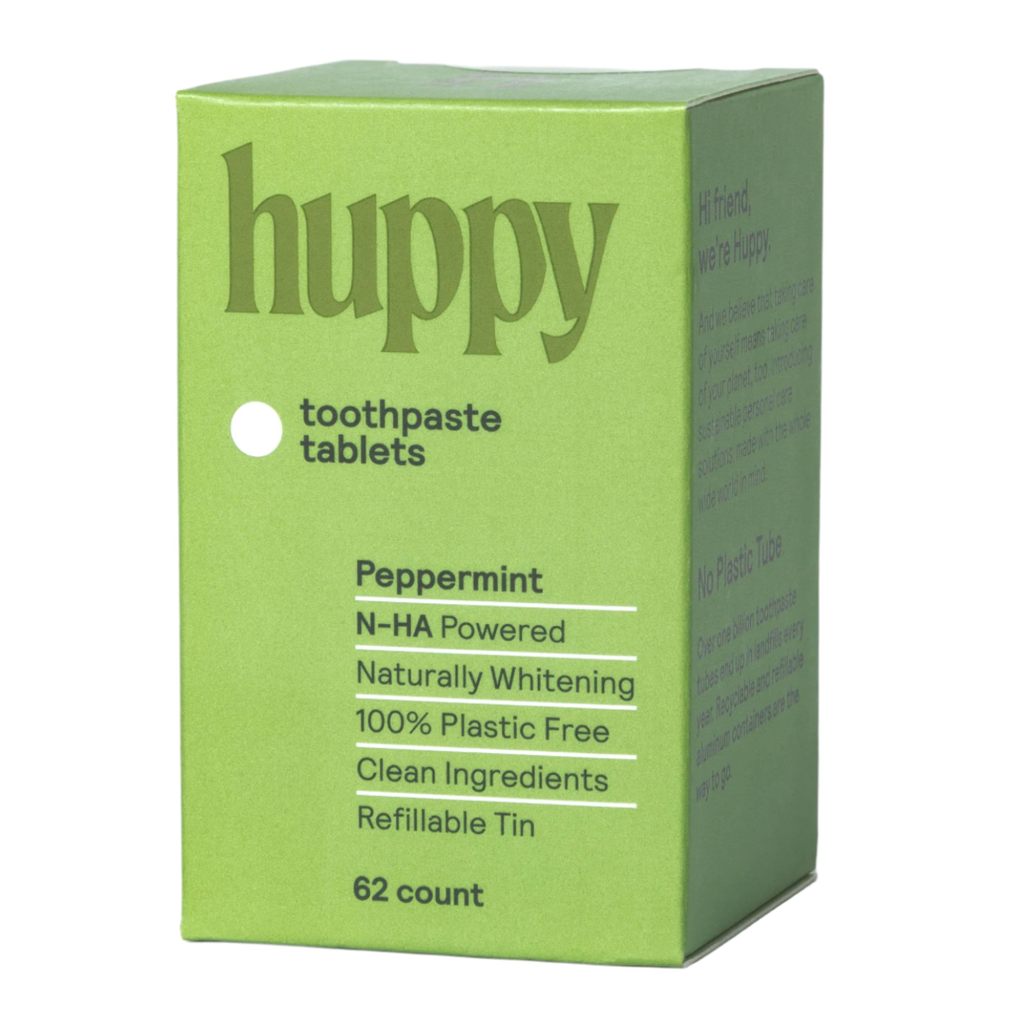 A sealed, light green 'huppy' box of peppermint toothpaste tablets. The label describes the contents as N-HA powered, naturally whitening, 100% plastic-free with clean ingredients, and a refillable tin containing 62 tablets.