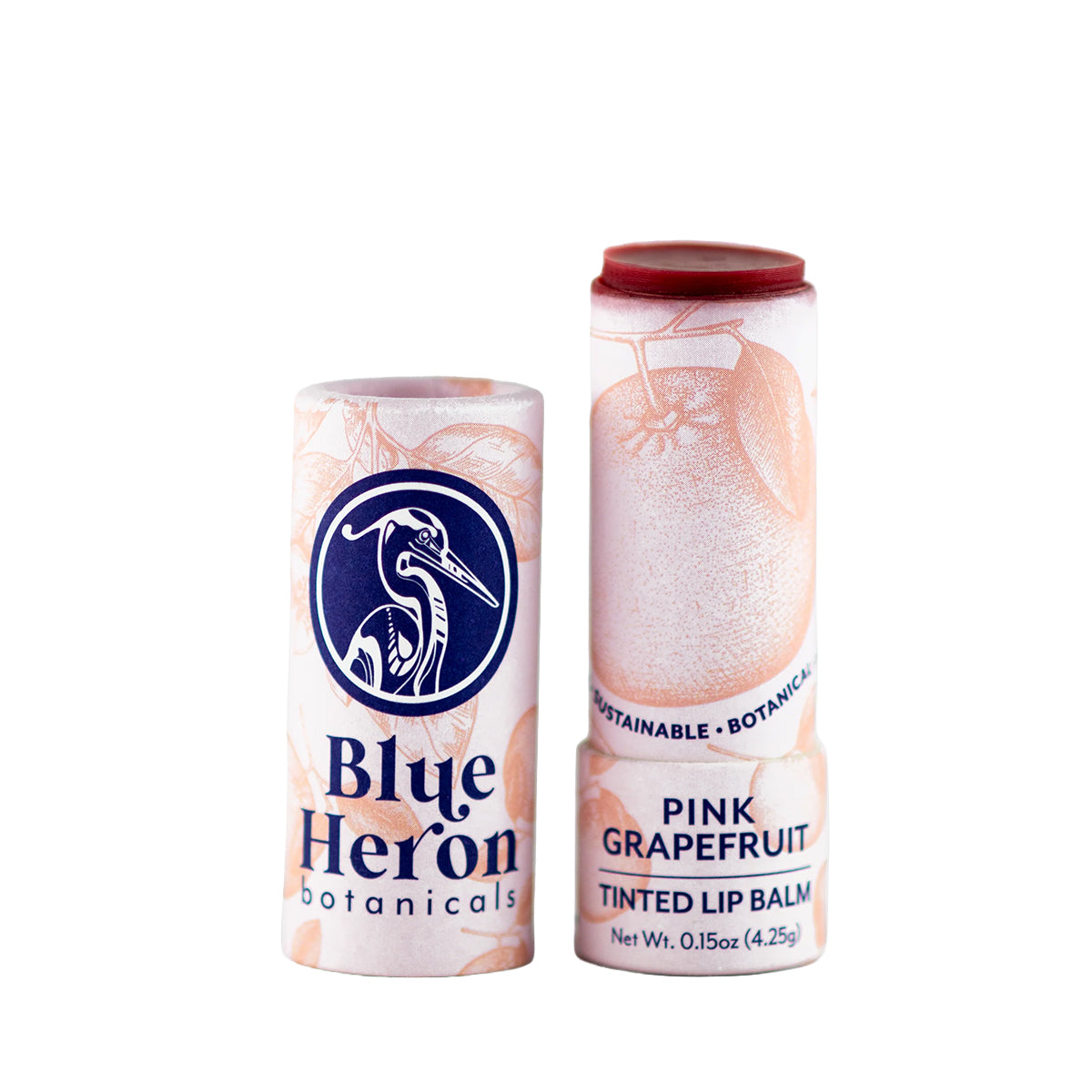 Pink Grapefruit lip balm tube from Blue Heron Botanicals on a white background