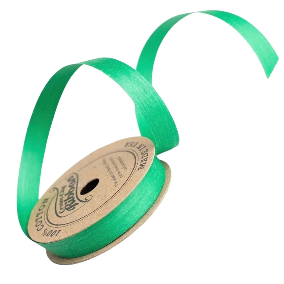 Vibrant green natural cotton curling ribbon made from 100% cotton yarn dyed with water-based, eco-friendly dyes. Compostable and sustainably produced in the USA.