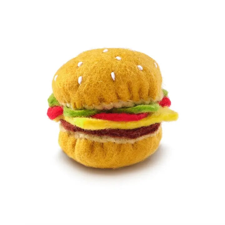 A felted wool hamburger cat toy with bun, lettuce, and patty details, naturally dyed and catnip-infused.