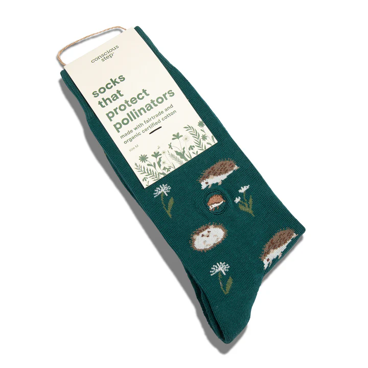 A pair of green socks with a pattern of porcupines is shown against a white background. the label says: socks that protect pollinators