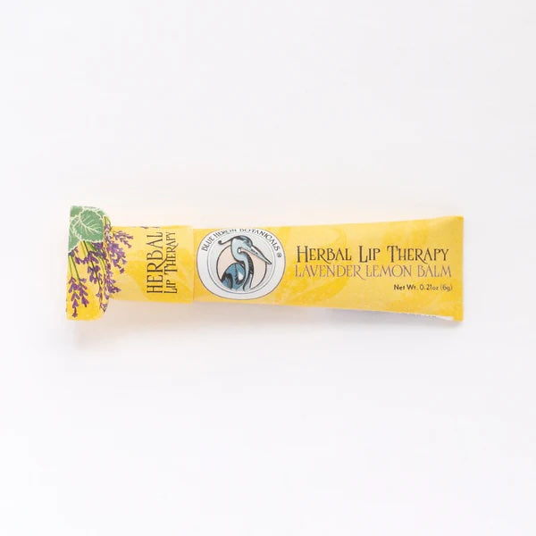 Herbal Lavender Lip Therapy Balm, an organic lip conditioner made with botanical butters and handcrafted in California.