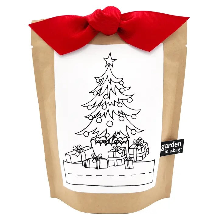 A brown paper "garden in a bag" pouch is tied with a bright red bow, making it a perfect holiday gift. The pouch features a label with a fun coloring page of a Christmas tree and gifts.
