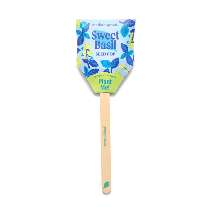A single "Sweet Basil" seed pop on a bamboo stick. The colorful paper top features basil leaf illustrations and the text "Plant Me!", making it a simple and cute way to grow fresh basil.