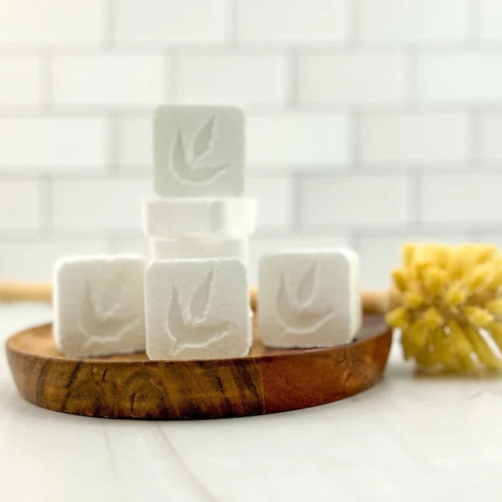 MamaSuds Toilet Bombs arranged on a wooden tray, highlighting the product’s natural ingredients.