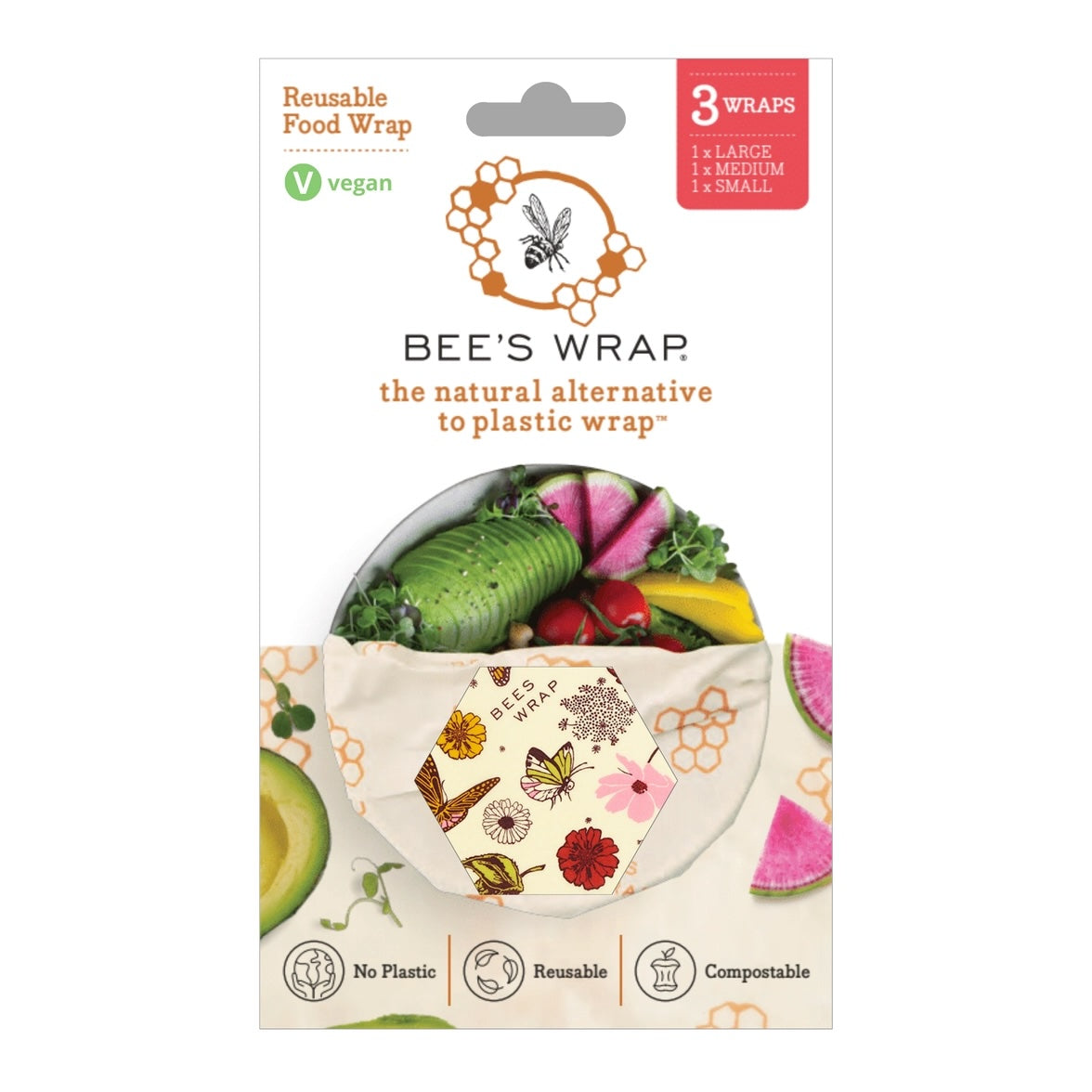 Packaging for Bee’s Wrap reusable food wraps showing a hexagonal window with a nature-themed pattern and fresh vegetables inside the wrap.