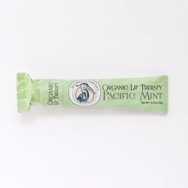 Pacific Mint Lip Therapy Balm in 100% recycled paperboard packaging, made with organic ingredients and botanical emollients.