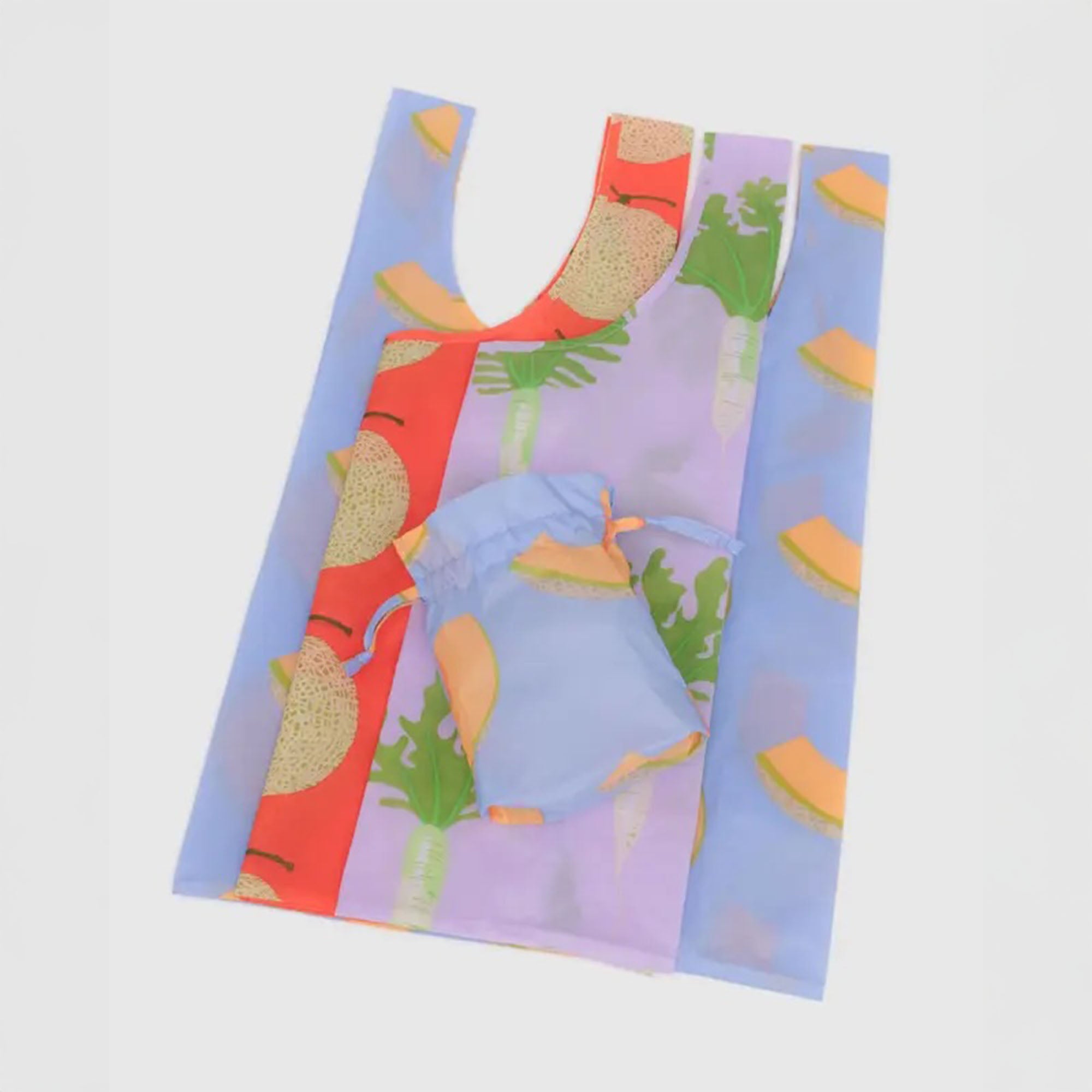 Flat lay of the BAGGU Produce Party set, showing three reusable bags laid out in full to highlight their playful fruit and veggie illustrations and compact, foldable design.