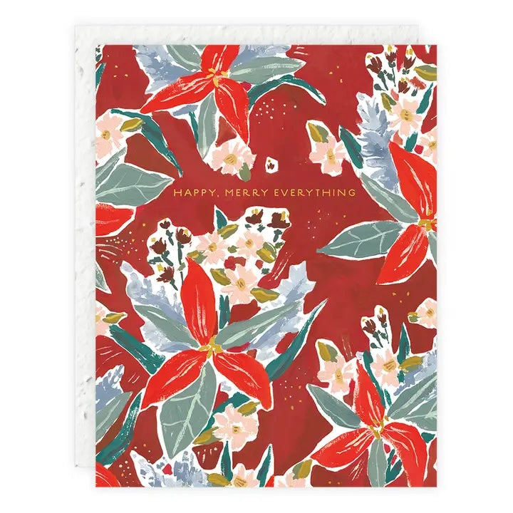 A seedling card with a bold floral pattern of red, white, and green leaves and flowers on a red background, with gold text: "HAPPY, MERRY EVERYTHING."