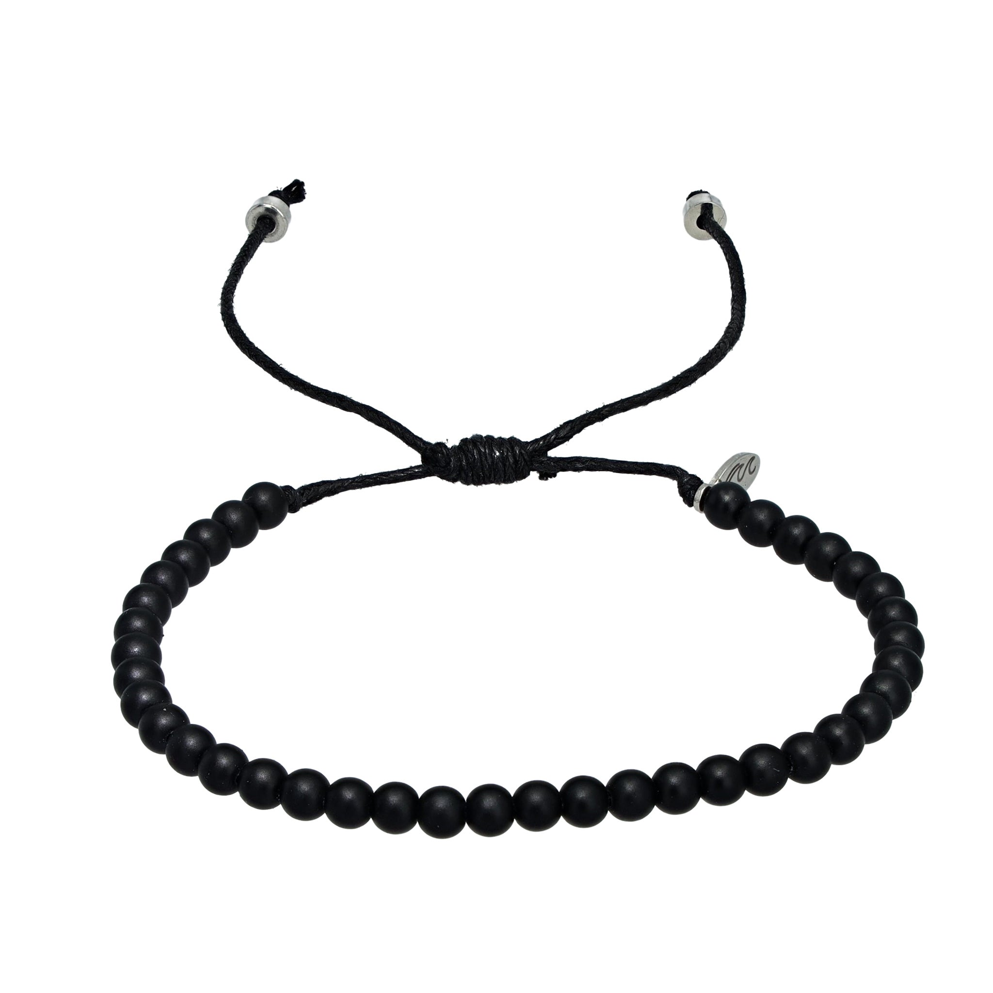 Black recycled ocean plastic bracelet with a stainless steel charm. Handmade in Bali and designed to help clean waterways.