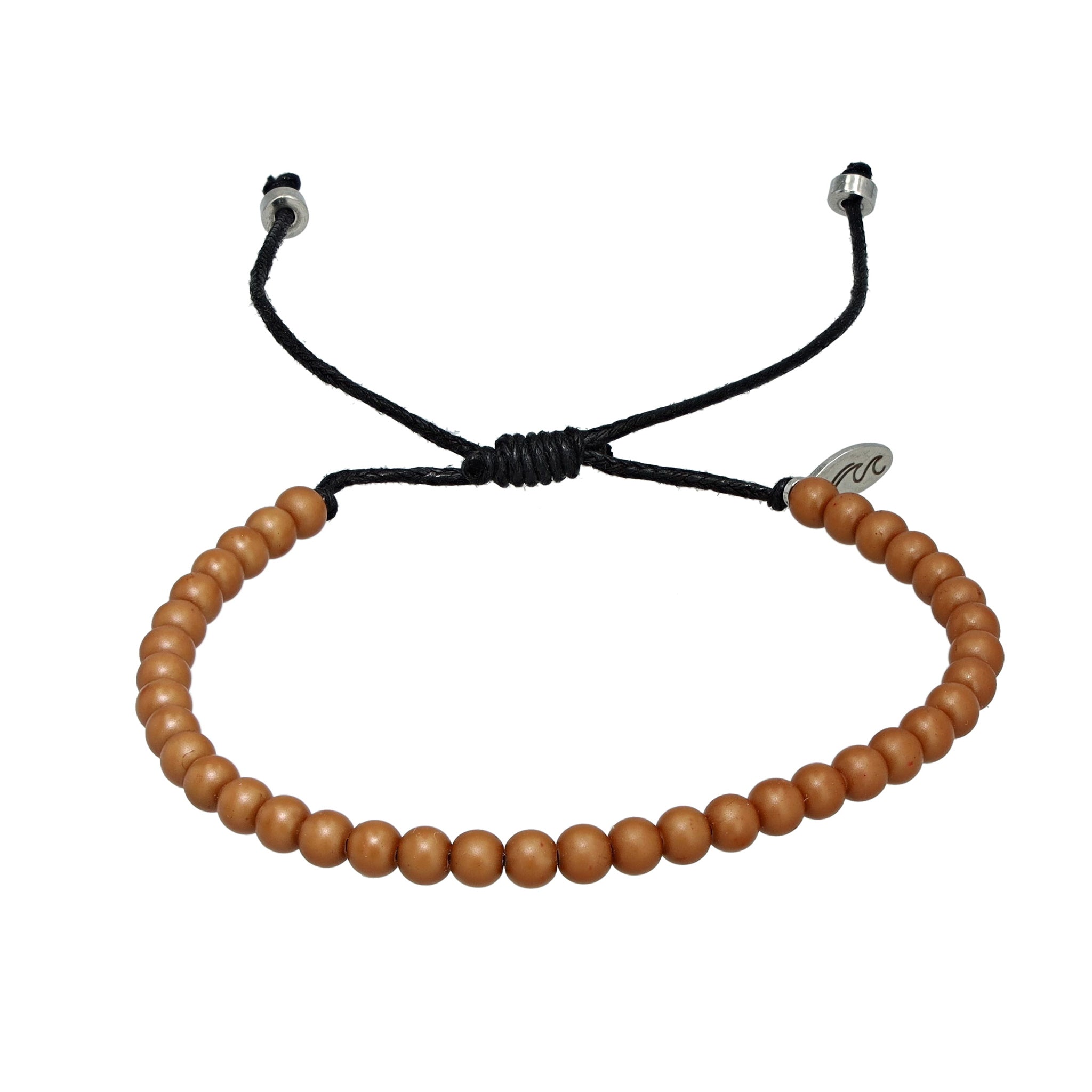 Caramel-toned bracelet made from recycled ocean plastic and finished with an adjustable cotton cord. Eco-conscious and handmade in Bali.