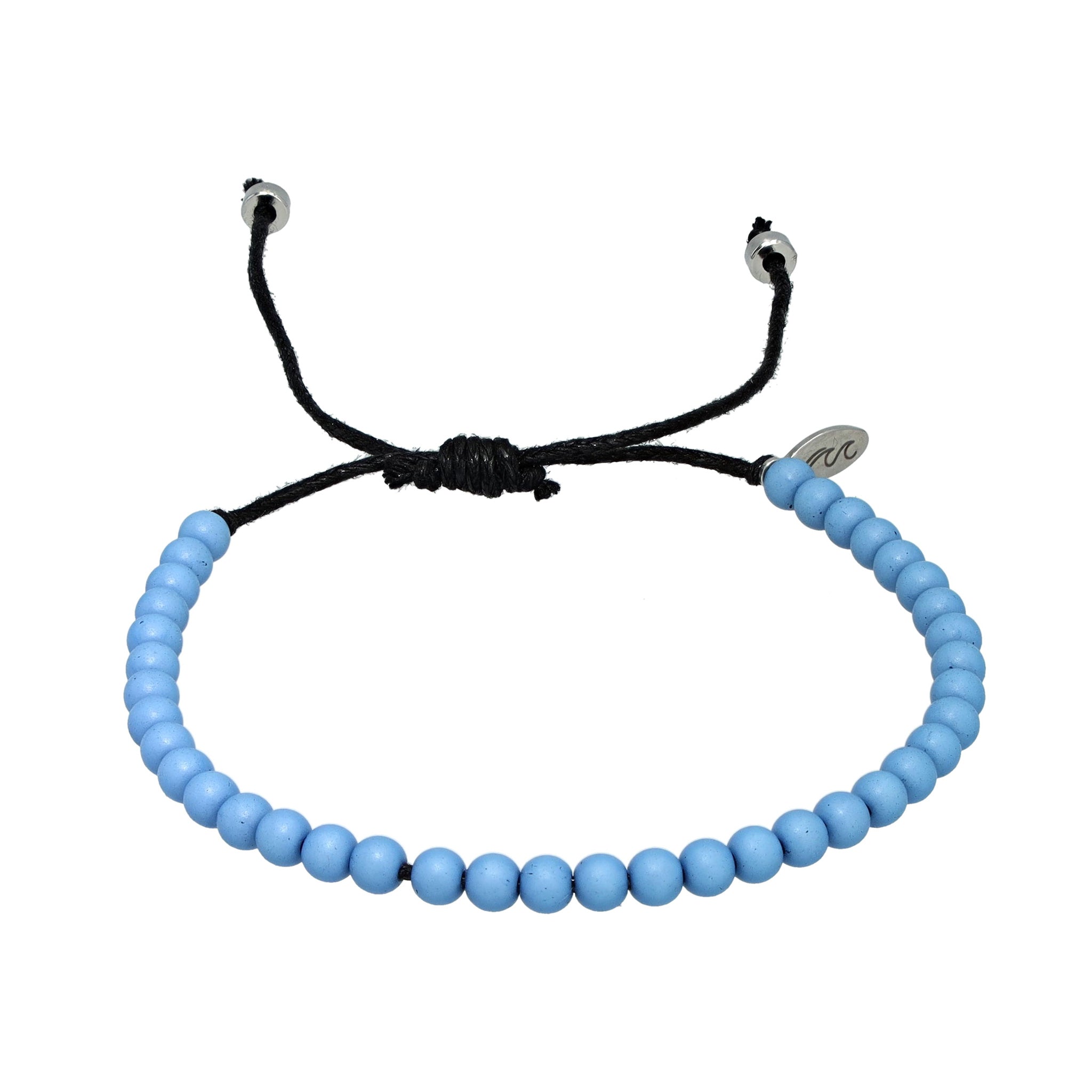 Light blue recycled ocean plastic bracelet with stainless steel charm and adjustable cotton cord. Handmade in Bali and water-safe.