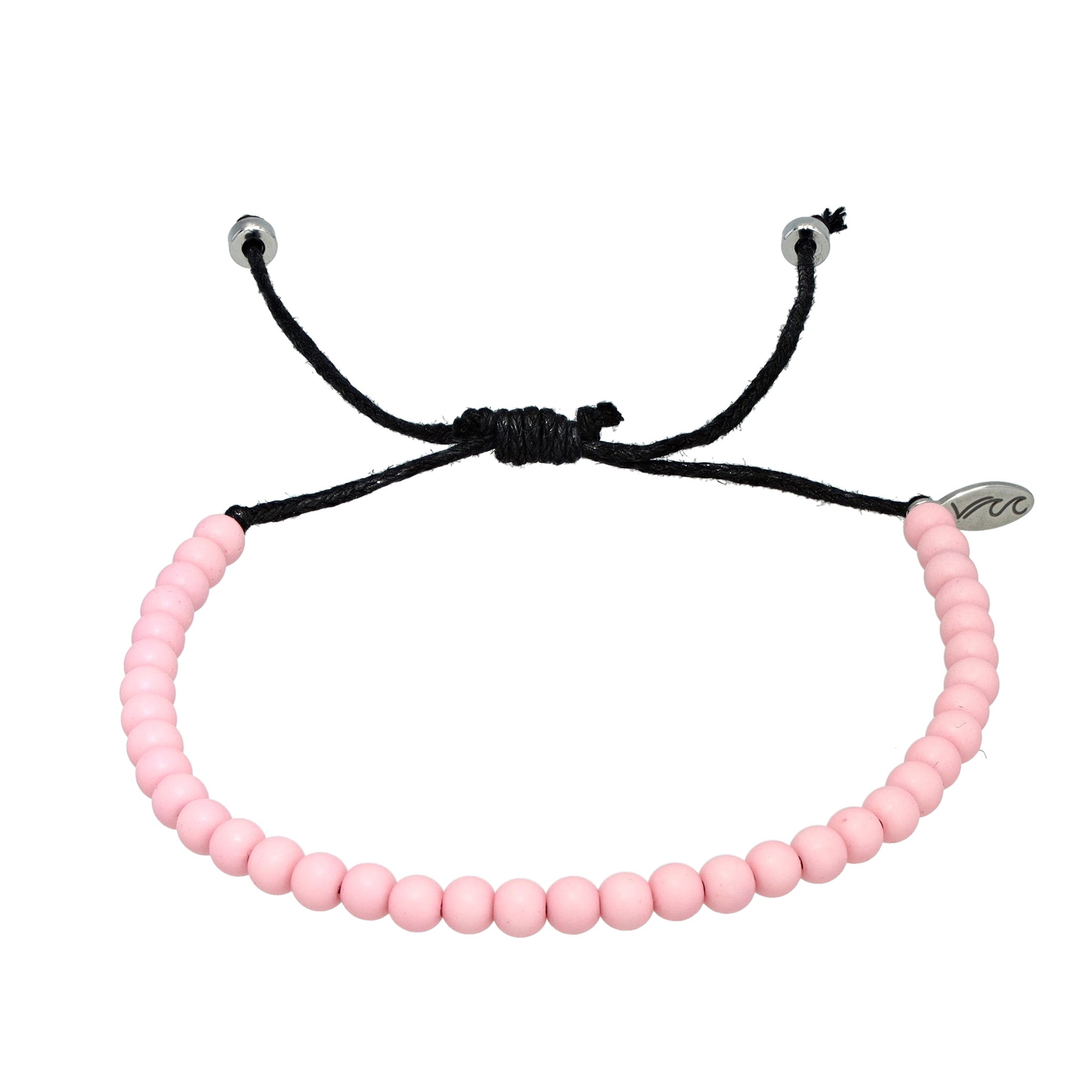 Soft pink bracelet crafted from recycled ocean plastic with a polished stainless steel charm. Adjustable, handmade in Bali, and supports ocean cleanup efforts.