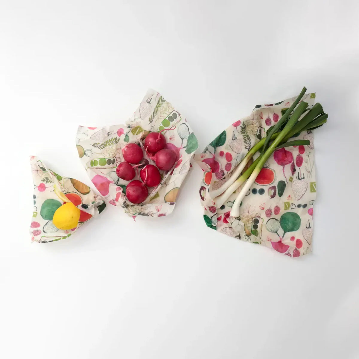 A variety of vegetables arranged together on Reusable Beeswax Food Wrap.