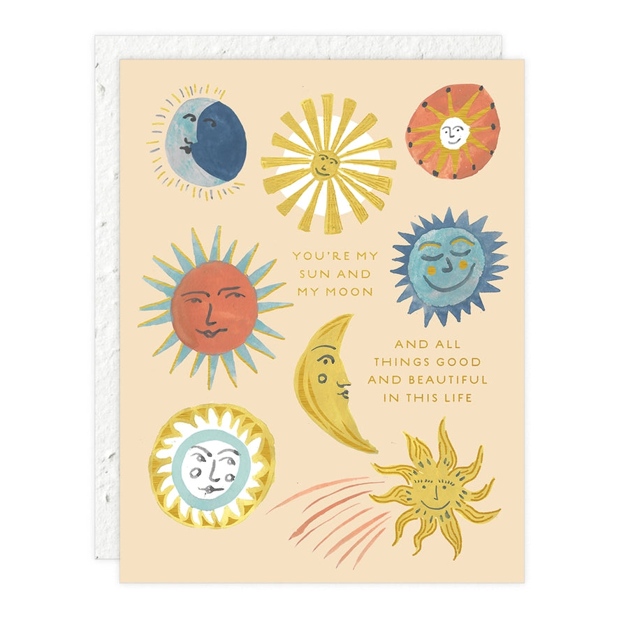 Various smiling suns and moons on a cream seedling card with the message "You're my sun and my moon and all things good and beautiful in this life."