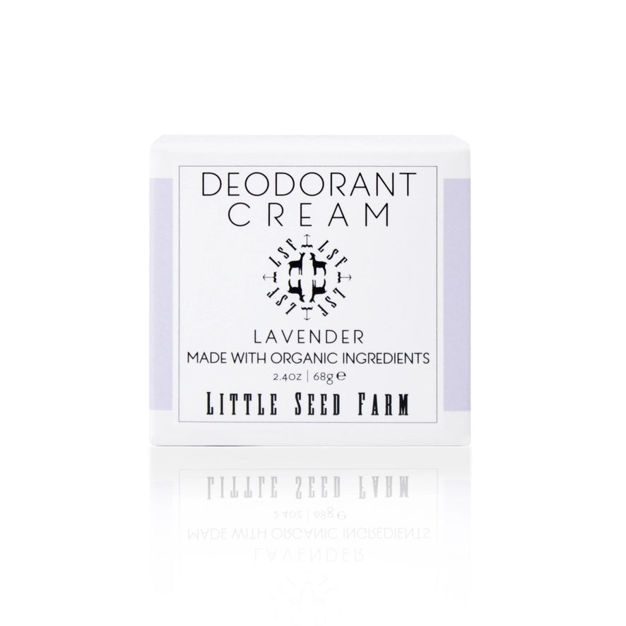 The box for a Little Seed Farm Lavender deodorant cream is on a reflective surface. The label states it's made with organic ingredients.