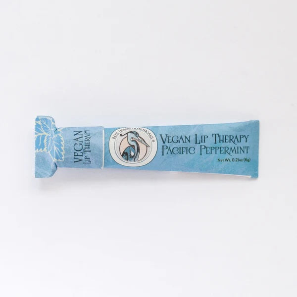 Peppermint Lip Therapy Balm displayed front-facing, made with cruelty-free, fair trade ingredients in compostable packaging.
