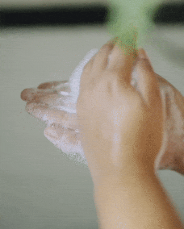 A video of a child's hands scrubing a shampoo or conditioner bar, the bar is foaming. The purpose of the video is to convey ease of use of the product.