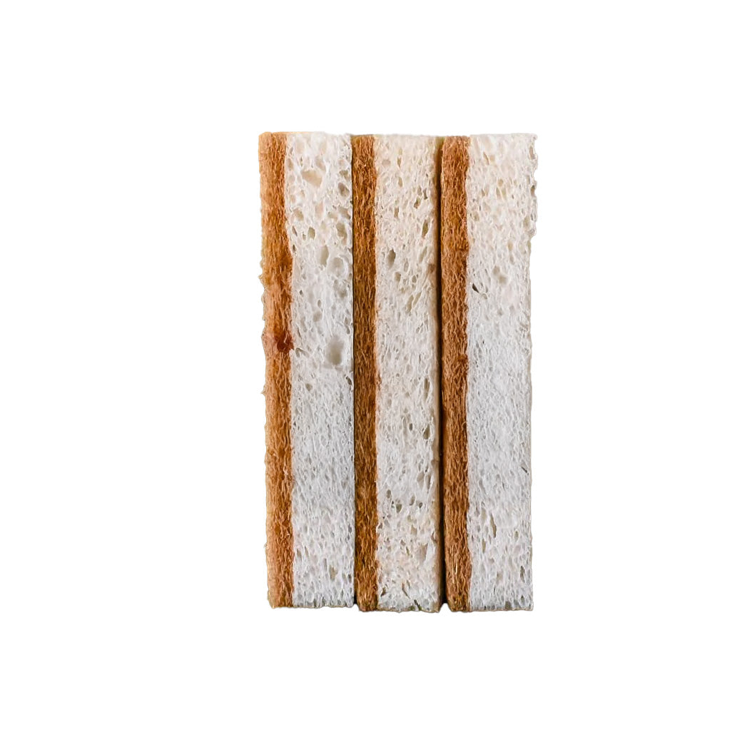 Three natural sponges stacked on a white background, highlighting their textured, porous surfaces made from sustainable coconut fiber and cellulose.