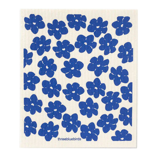 Striking electric blue poppy flowers adorn this reusable biodegradable and organic dishcloth
