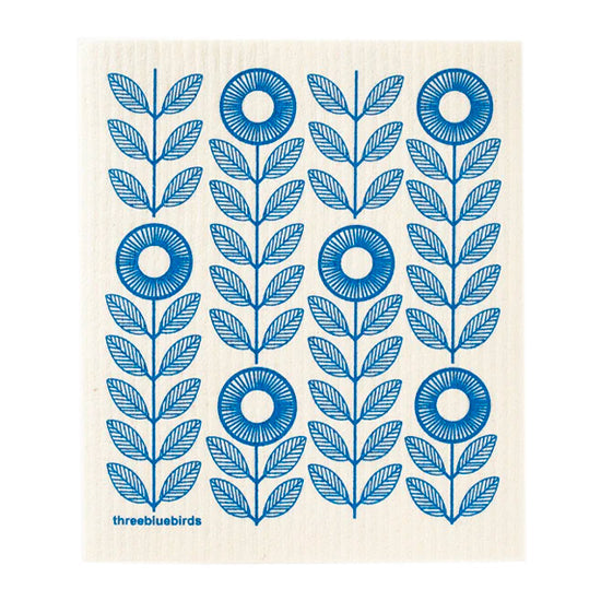 Deep blue sunflowers create a striking design on this reusable dishcloth, ready for versatile cleaning