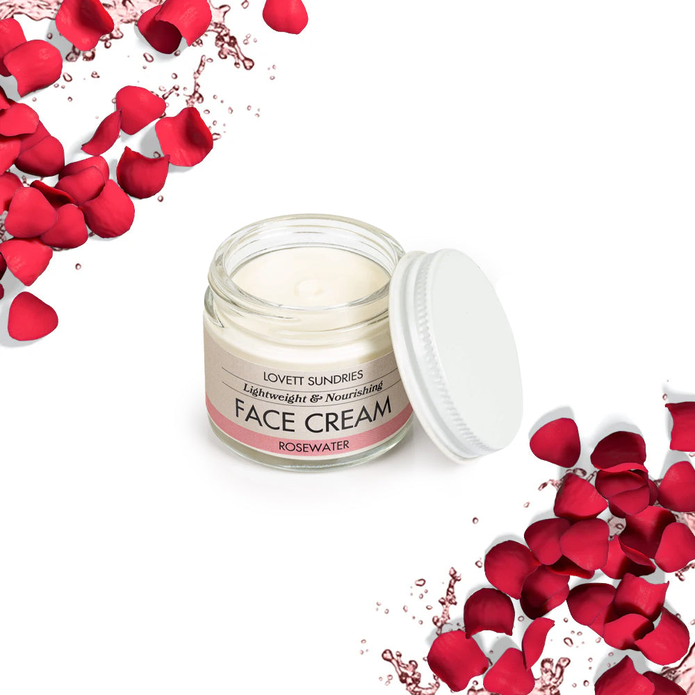 Rosewater face cream jar with rose petals on the sides.