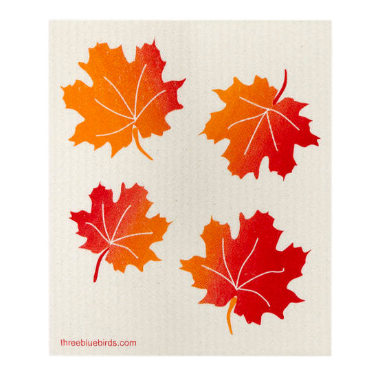 A vibrant pattern of autumn maple leaves in fiery red, golden orange, and sunny yellow adorns this reusable dishcloth, suitable for use with your preferred cleaning solutions