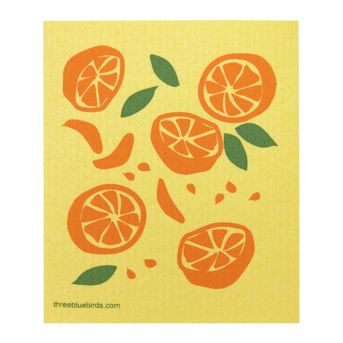 Juicy orange oranges and fresh green leaves on a bright yellow reusable dishcloth, suitable for use with water, soap, or cleaner
