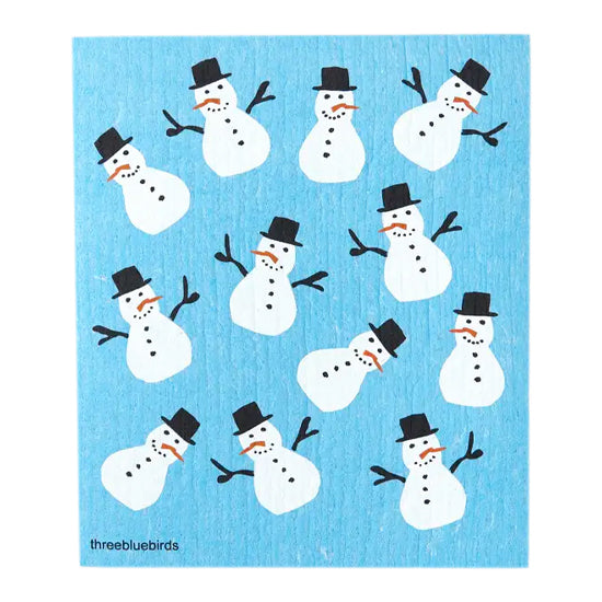 Cheerful white snowmen with black top hats and orange carrot noses smile against a clear blue winter back on this reusable dishcloth