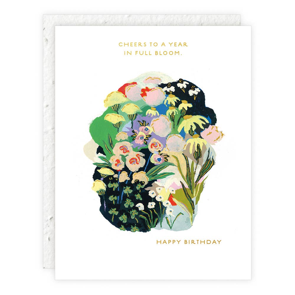 Seedling card showing a vibrant floral bouquet of yellow, pink, purple, and white flowers with green leaves. Text reads: "Cheers to a year in full bloom. Happy Birthday."