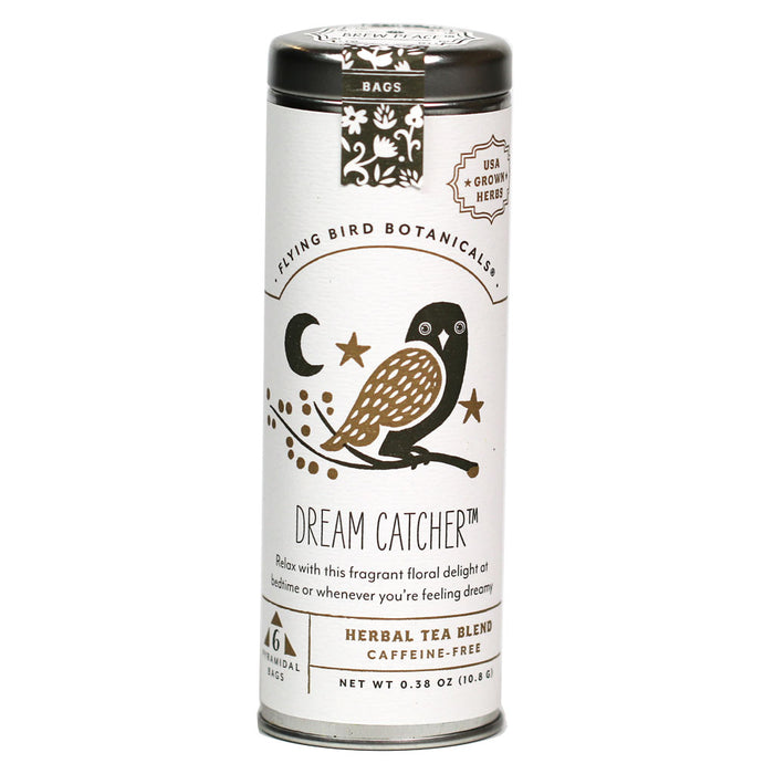 A metal tin of Flying Bird Botanicals' "Dream Catcher" tea is shown, featuring a label with an illustration of a brown and black owl on a branch, a crescent moon and stars. The label describes it as a "CAFFEINE-FREE" "HERBAL TEA BLEND" meant to help you "Relax" at bedtime.