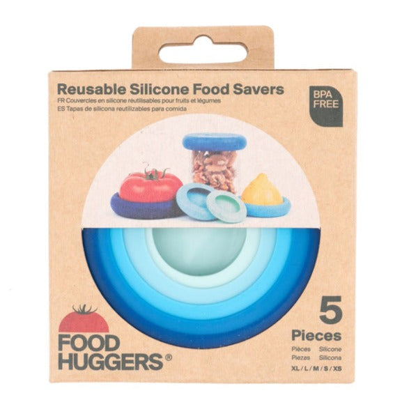 A box of "Food Huggers" reusable silicone food savers. The box is made of cardboard with a window showing a gradient of blue savers and text that says "5 Pieces" and "BPA FREE".