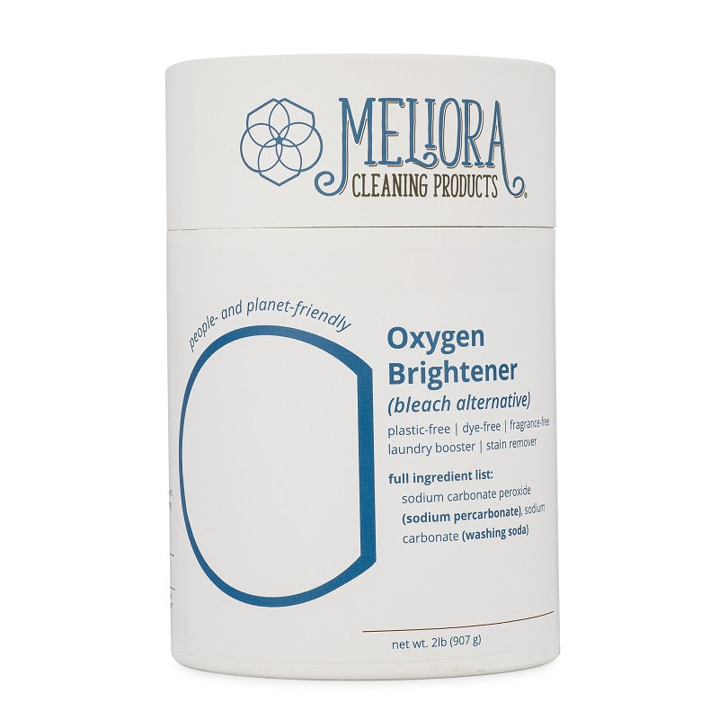 A white cylindrical container for Mellora Cleaning Products Oxygen Brightener is shown. The label identifies the product as a "bleach alternative" and lists several features, including "people- and planet-friendly", "plastic-free", "dye-free", "fragrance-free", "laundry booster" and "stain remover". The full ingredient list is provided, which includes sodium carbonate peroxide and sodium carbonate. The container holds 2 lbs (907 g) of the product.