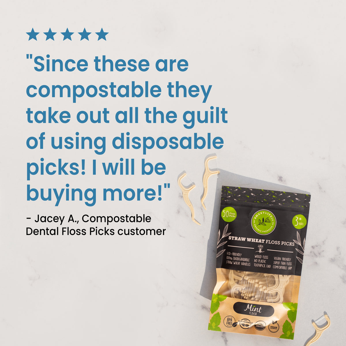 A cute customer review with five stars says "Since these are compostable they take out all the guilt of using disposable picks! I will be buying more!" The review is next to a pouch of mint-flavored floss picks.